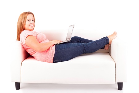 Young overweighted woman relaxing at homeの写真素材