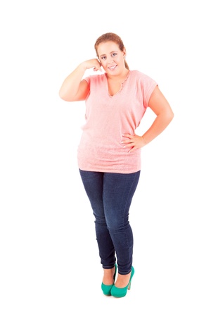 Happy overweighted woman posing isolated over white backgroundの写真素材