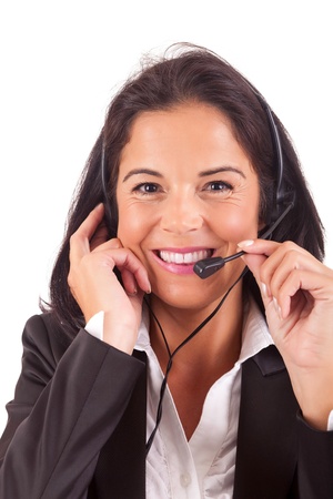 Friendly young beautiful telephone operator at workの写真素材
