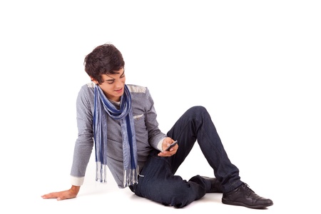 Young boy at the phone, isolated over whiteの写真素材