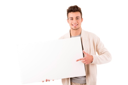 A young casual man holding a white cardの写真素材