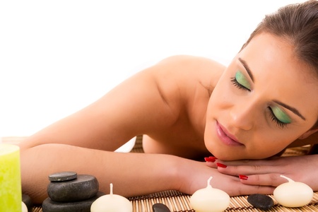 A young beautiful woman relaxing at a spa (wellness concept)の写真素材
