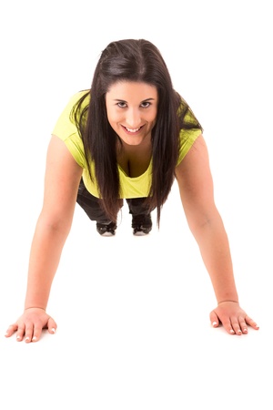 Beautiful large woman exercising - isolated over a white backgroundの写真素材