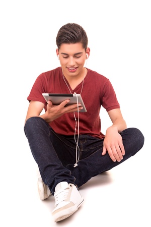 Young  happy student working with a new digital tablet computerの写真素材