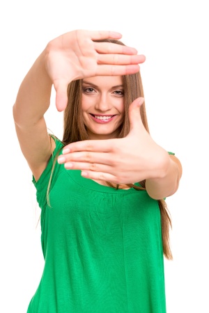 Young woman making framing key gesture - isolated over whiteの写真素材