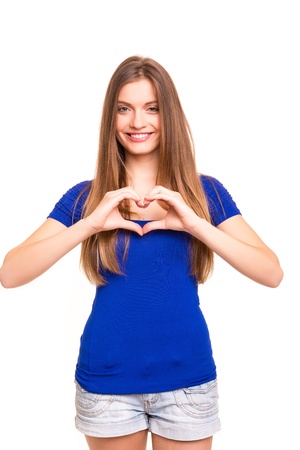 Beautiful woman making a heart shape with her hands, isolated over white backgroundの写真素材