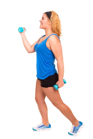 Beautiful large woman exercising - isolated over a white backgroundの写真素材