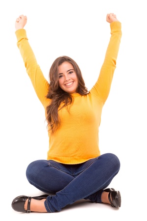 Very happy woman raising her arms and celebratingの写真素材