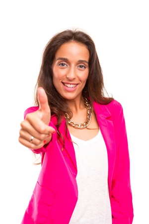 Young business woman signaling ok, isolated over white backgroundの写真素材