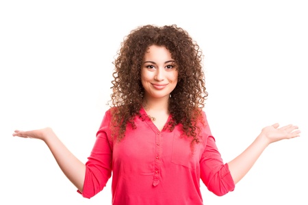 Young beautiful woman presenting your product, isolated over white backgroundの写真素材