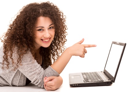 Young asian student working with her laptop, isolated over a white backgroundの写真素材