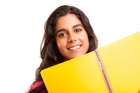 Young and beautiful student posing isolated over white