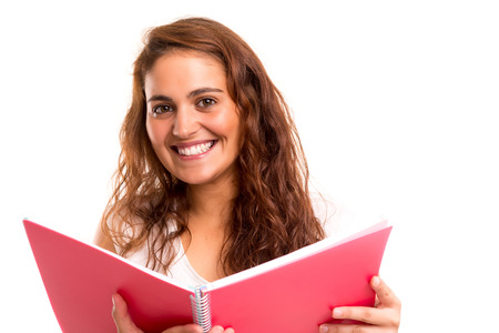 Young student woman posing over white backgroundの写真素材