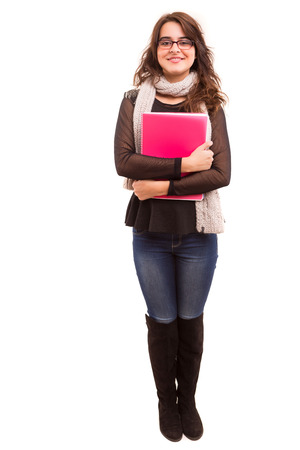A beautiful student posing isolated over a white の写真素材