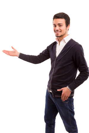 Young man presenting your product, isolated over a white backgroundの写真素材