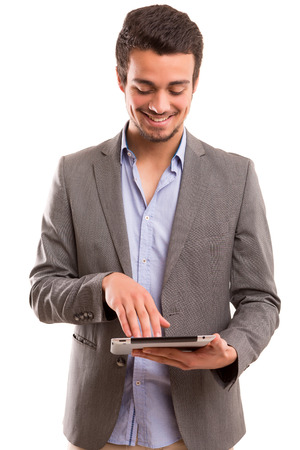 Young handsome man working with tablet computerの写真素材