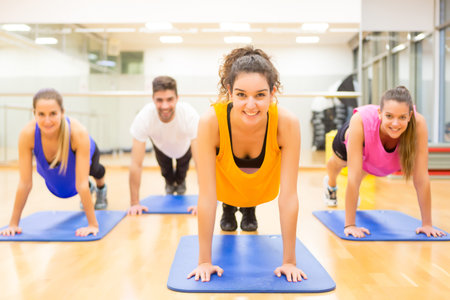 Group of friends working out at the gym