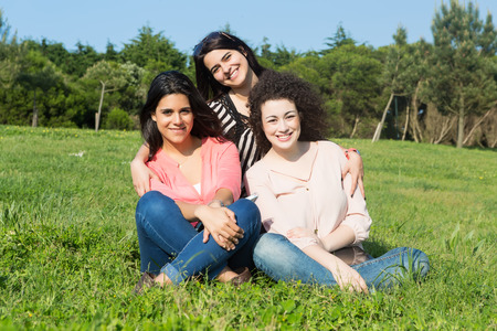 A group of students relaxing at the parkの写真素材