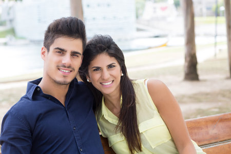 young couple in love, relaxing at the city parkの写真素材