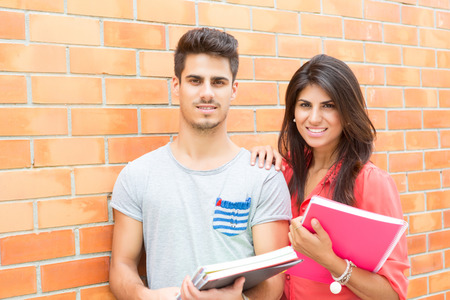 Couple of happy students at the university campusの写真素材
