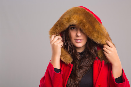 A beautiful young woman dressed for winterの写真素材