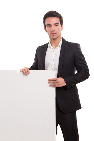 Handsome business man presenting your product on a white boardの写真素材