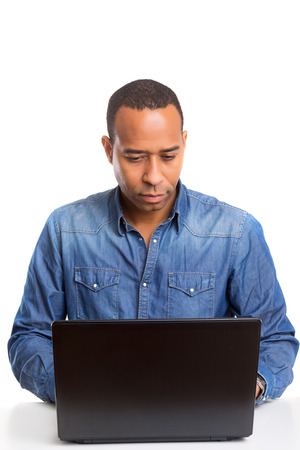 A young african business man working with a laptopの写真素材