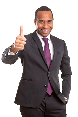 Handsome young african business man signaling ok, isolated over whiteの写真素材