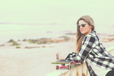 Fashion lifestyle, Beautiful young woman with skateboard