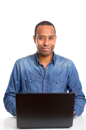 A young african business man working with a laptopの写真素材