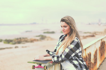 Fashion lifestyle, Beautiful young woman with skateboard