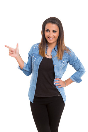 Young beautiful woman presenting your product, isolated over white backgroundの写真素材