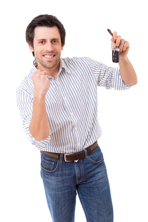 Young adult holding the keys of a new carの写真素材
