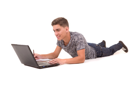 Young boy studying, isolated over a white backgroundの写真素材