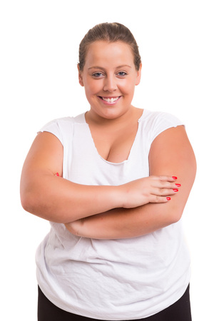 Beautiful large woman exercising - isolated over a white backgroundの写真素材