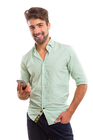 Young man at the phone, isolated over white backgroundの写真素材