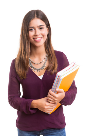 Young student posing over a white backgroundの写真素材