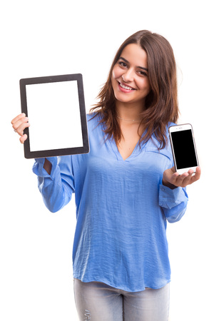 Business woman presenting your product on a last generation smartphone and tablet computerの写真素材