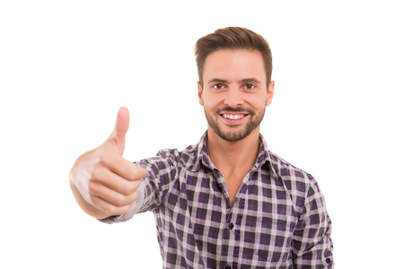 Handsome young man signaling ok, isolated over a white backgroundの写真素材