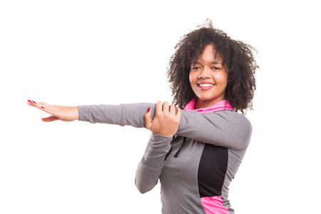 Studio shot of a beautiful african woman exercising