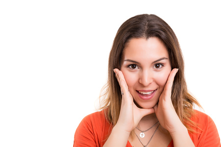 Surprised young woman isolated over white backgroundの写真素材