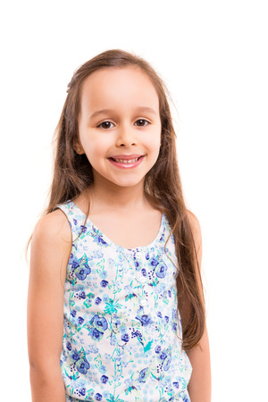 Beautiful young girl posing isolated over whiteの写真素材