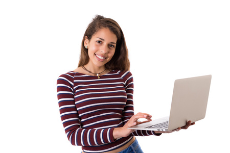 Young student working with her laptop, isolated over a white backgroundの写真素材