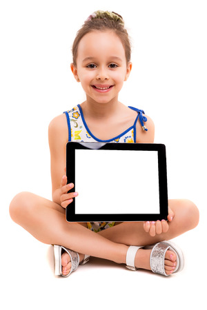 Small girl playing with her new tablet computerの写真素材