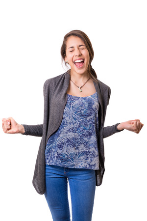 Studio shot: Happy woman with raised armsの写真素材