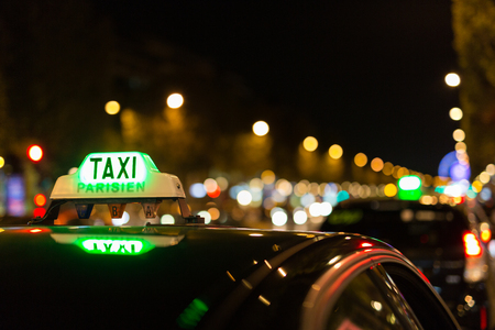 French taxi with the champs elysees avenue in backgroundの写真素材
