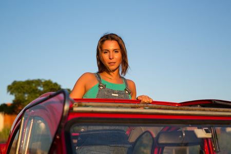 Woman going on a roadtrip in her convertible carの写真素材