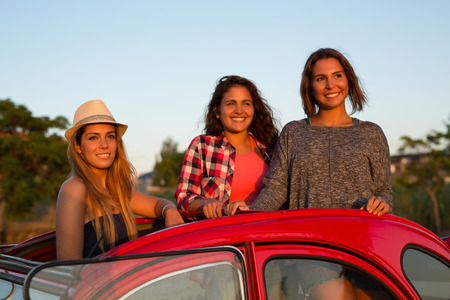 Group of friends on a roadtrip through countrysideの写真素材