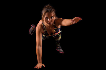 A beautiful young woman exercising - fitness concept