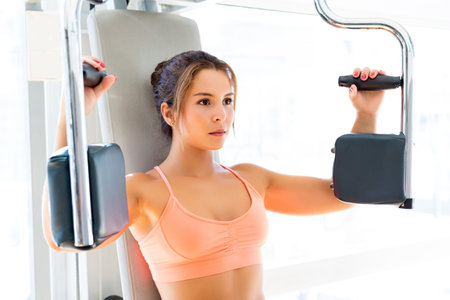 Young woman getting into shape with one more training session 